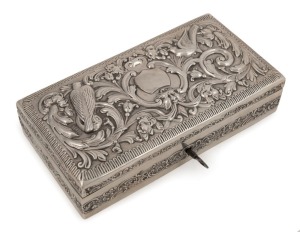 An antique sterling silver jewellery box with repousse decoration interior lined with blue velvet and ebony, by William Comyns of London, circa 1897, with original key, 4.5cm high 18cm wide, 9.5cm deep