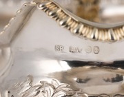 A Georgian three piece sterling silver tea service with engraved and repousse floral decoration, made in London, circa 1821, ​​​​​​​the teapot 15cm high, 27cm wide, 1200 grams total - 4