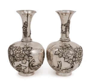 A pair of Japanese silver stem vases adorned with koi carp, wisteria, iris and peonies, 19th/20th century, seal mark to base, 13.5cm high, 250 grams