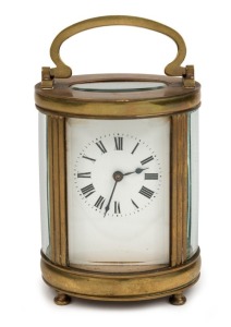 An antique French oval case carriage clock in original leather travel case, 19th century, ​​​​​​​15cm high overall