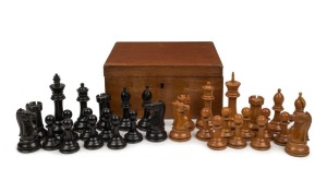 STAUNTON antique English chess set in boxwood and ebony, housed in a mahogany box with green felt lining, 19th century, bearing crown mark, the king pieces 11.3cm high