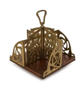 An Austrian revolving desk-top bookstand with bird motif, oak and brass, circa 1900, 30cm high, 24cm wide, 24cm deep