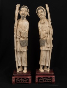 A pair of antique Chinese carved ivory statues of a fisherman and wife, on carved wooden stands, 19th/20th century, 33.5cm high