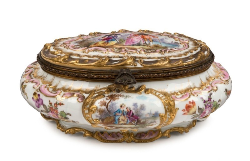 A superb Berlin Porcelain lidded jewellery casket with ormolu mounts, 19th century, blue cross swords mark to base, 11cm high, 25cm wide, 18cm deep