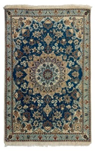 A Persian hand-knotted wool rug with blue and cream geometric design, ​​​​​​​140cm x 85cm