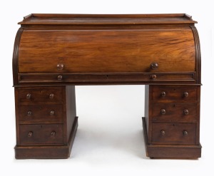 An antique English mahogany cylinder top twin pedestal desk with well fitted interior veneered in maple, sliding desk top and leather inset adjustable slope, each pedestal with three graduated drawers, circa 1860, 112cm high, 149cm wide, 68cm deep