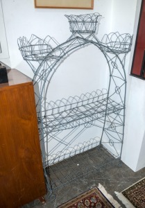 An antique wirework plant stand, 19th century, 150cm high x 100cm wide x 32cm deep