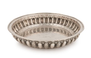 An antique Tibetan silver bowl with floral motif, 19th/20th century, ​​​​​​​23.5cm wide, 392 grams