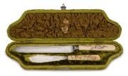 A stunning pair of antique serving knives with Shibayama ivory handles and silver plated blades, housed in original plush fitted box, 19th century, the box 31.5cm wide