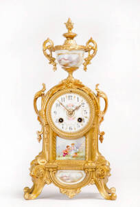 French mantle clock; floral porcelain panels in gilt metal case, late 19th century. Height 37cm