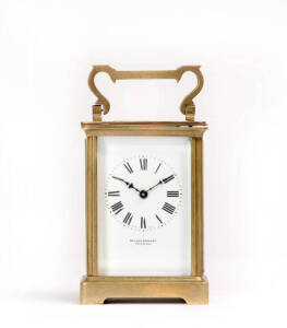 CARRIAGE CLOCK: French late 19th century with original key & leather case, sold by Wilson & Sharp of Edinburgh. Height 14.5cm