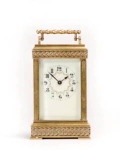 CARRIAGE CLOCK: French late 19th century with floral enamel dial & unusual basket weave brass case. Height 14.5cm