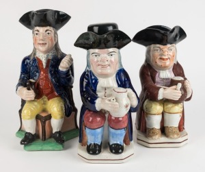 Three Georgian Toby jugs, 18th/19th century, the largest 23cm high