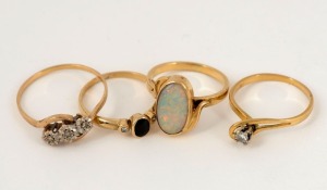 Four assorted gold rings, set with diamonds or opals, ​​​​​​​9 grams total