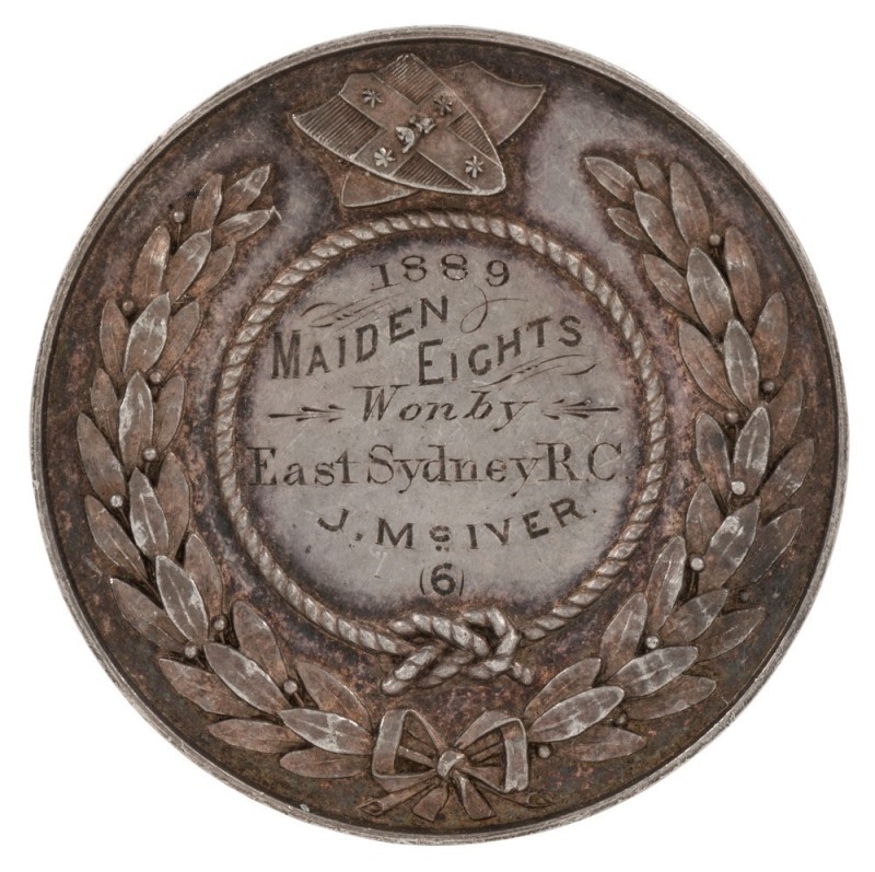 N.S.W. ROWING ASSOCIATION silver medal, engraved verso "1889 MAIDEN EIGHTS Won by East Sydney R.C. J. McIVER (6)" One other example known in the Sir William Sixson Collection at the State Library of N.S.W. The New South Wales Rowing Association (NSWRA) wa