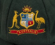 THE AUSTRALIAN BAGGY GREEN WORN BY KIM HUGHES DURING HIS FINAL TEST MATCH AS CAPTAIN, DECEMBER 1984 Kim Hughes, in his final Test and final Test as Captain, exchanged this cap with Clive Lloyd, the West Indies captain, who was also in his last Test Match - 2