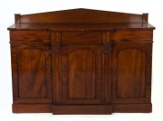 An antique English mahogany three door hall cabinet with break front and Palladian back, circa 1840, 101cm high, 134cm wide, 35cm deep