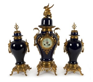 An antique French three piece blue porcelain clock set with ornate ormolu mounts, 8 day time and bell striking movement with Arabic numerals, 19th century, ​​​​​​​60cm high