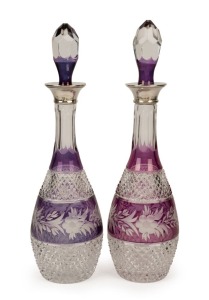 A pair of Bohemian cut crystal decanters with amethyst overlay and English sterling silver mounts, 20th century, 39cm high