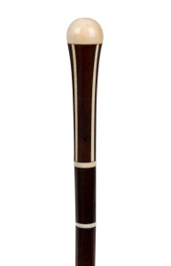 An antique walking stick with ivory top and decoration on a snakewood shaft with brass ferrule, 19th century, 95cm high