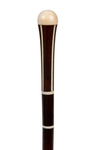 An antique walking stick with ivory top and decoration on a snakewood shaft with brass ferrule, 19th century, 95cm high