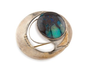 A vintage Australian modernist brooch, sterling silver and 9ct gold with polished boulder opal in matrix, stamped "375, ST. SILVER", ​​​​​​​4.7cm wide, 13.4 grams total
