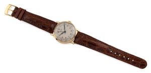 ARSA "EXTRA" manual wristwatch in solid 18ct gold case with silver dial, dual date windows and brown leather band, circa 1960. 3.8 cm wide including crown