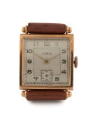 CYPRUS manual wristwatch in square solid 9ct gold case, silver dial, subsidiary second hand, Arabic numerals and brown leather band, circa 1960. 2.7cm wide including crown - 2