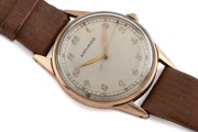 MOVADO manual wristwatch in solid 9ct gold case, silver dial with Arabic numerals and brown leather band, circa 1960. 3.4cm wide including crown - 2