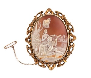 An antique cameo brooch with carved romantic scene in the Renaissance style, mounted in 9ct yellow gold, 19th century, an impressive 7cm high