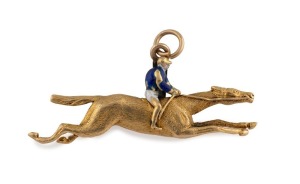 An antique 18ct yellow gold horse racing pendant with enamel decoration, 19th century, 3.5cm wide, 5.6 grams