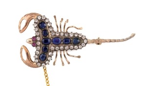 An antique scorpion brooch, 9ct yellow gold, set with ruby eyes, amethysts and white stones, late 19th century,  6cm long, 9.6 grams 