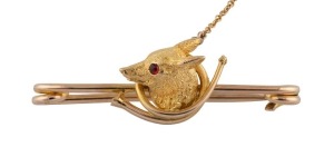 An antique 9ct yellow gold fox head brooch with ruby eyes, 19th century, ​​​​​​​4.5cm wide, 7.4 grams