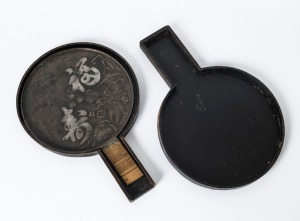 An antique Japanese bronze hand mirror with original rattan handle and travelling case, Meiji period, 19th century, 34cm high