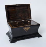An antique English tea caddy with lacquered black Japanned finish and ornate brass mounts, interior fitted with two compartments with hand-painted simulated walnut finish, 19th century, 12cm high, 23.5cm wide, 15.5cm deep - 2