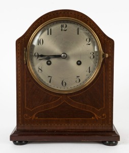 An antique German mantle clock with inlaid mahogany case, time and strike movement with Arabic numerals, early 20th century, 26cm high