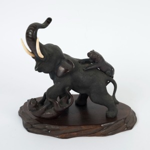 An antique Japanese bronze statue of an elephant and tigers, Meiji period, 19th century, impressed seal mark to underside, 20cm high overall