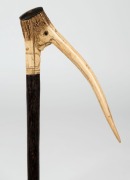 An antique walking stick with novelty handle made from carved deer antler, with palm wood shaft and bone ferrule, 19th century, 94cm high - 2