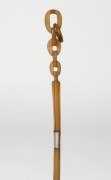 An antique walking stick, carved horn chain link handle with silver finished collar and brass ferrule, 19th century, 89cm high