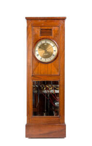 CLOCK by W. Simpson in walnut case with George Graham deadbeat escapement. Complexities include seconds sweep hand, day, date, month & strike on the hour. Also plays tunes on 4 adjustable tone gongs. Mechanical/electrical with 3 weight, pendulum & accesso