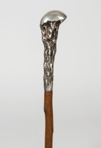 An antique walking stick with unusual American sterling silver top, blackthorn shaft and brass ferrule, 19th century, inscribed "GEO. HARTWELL, CHICAGO, ILL.", 94cm high