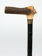 An antique walking stick with horn handle carved in the form of a fox head with glass eyes, gold plated collar and carved ebony shaft with remains of horn ferrule, 19th century, ​​​​​​91.5cm high - 3