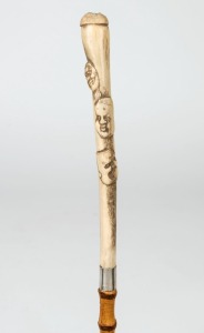 An antique Japanese walking stick with carved bone handle, silver collar, bamboo shaft and brass ferrule, 19th20th century, 91.5cm high