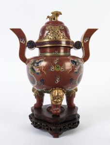 An antique Chinese cloisonne censer with dragon decoration and Foo dog finial, Qing Dynasty, 19th century, with later wooden stand, 25cm high