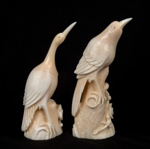 A pair of Chinese carved marine ivory bird ornaments, 19th/20th century, the larger 12.5cm high
