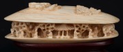 An antique Chinese carved ivory clam shell ornament, on wooden stand, early 20th century, ​​​​​​​5.5cm high overall, 10.5cm wide - 2