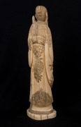 An antique Japanese marine ivory carved statue of a man, Meiji Period, 19th century, 25cm high - 2