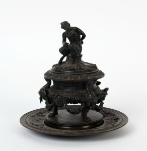 An antique French figural bronze lidded inkwell with tray, 19th century, 19cm high
