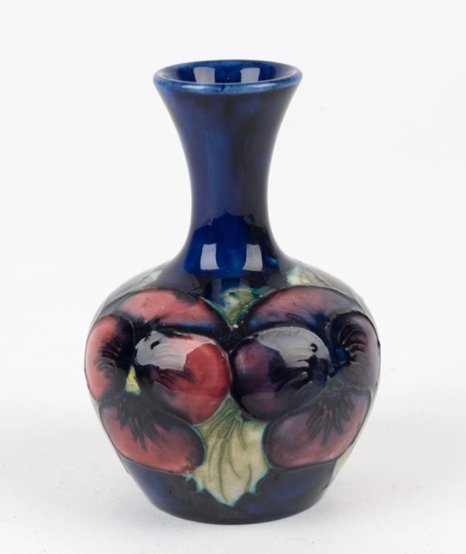 MOORCROFT "Pansy" pattern English pottery miniature vase on blue ground, 9cm high