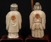 A pair of antique Chinese carved ivory statues of peasants, with wooden stands, 19th/20th century, statues 11cm high, the larger 22cm high overall - 3